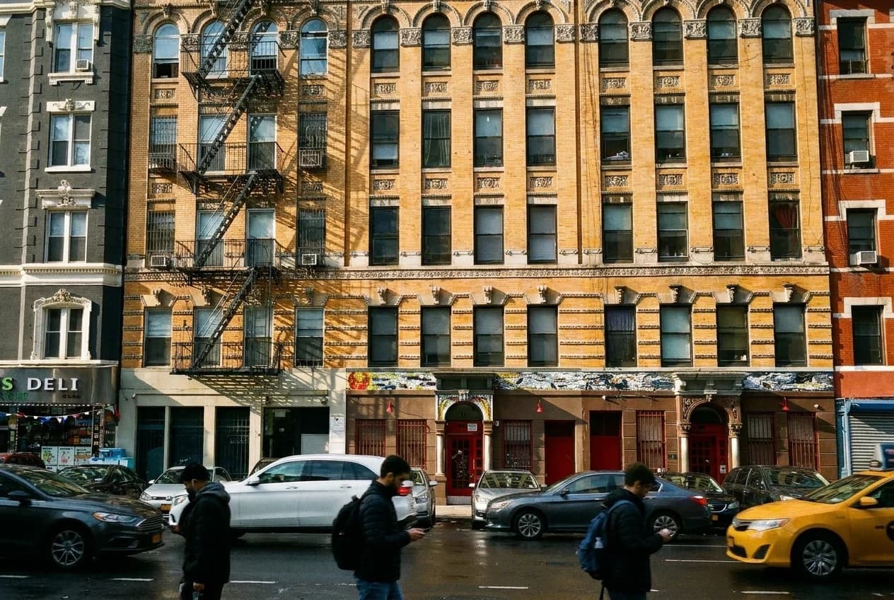 Clinton Street morning light on brick walk-ups and restaurant storefronts, Lower East Side