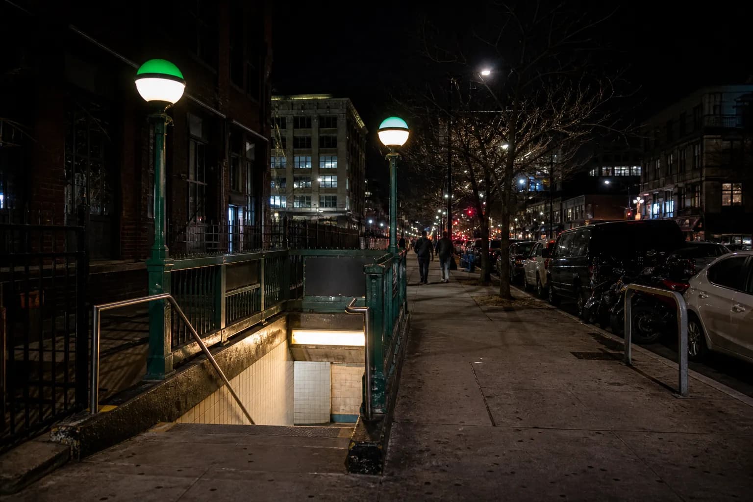 A late-night Brooklyn subway entrance near a nightlife corridor