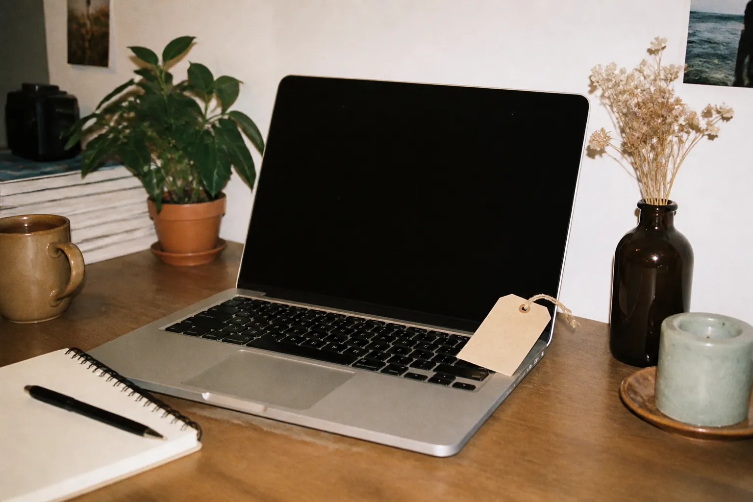 A laptop with a small discount tag sitting on a desk ready for a student