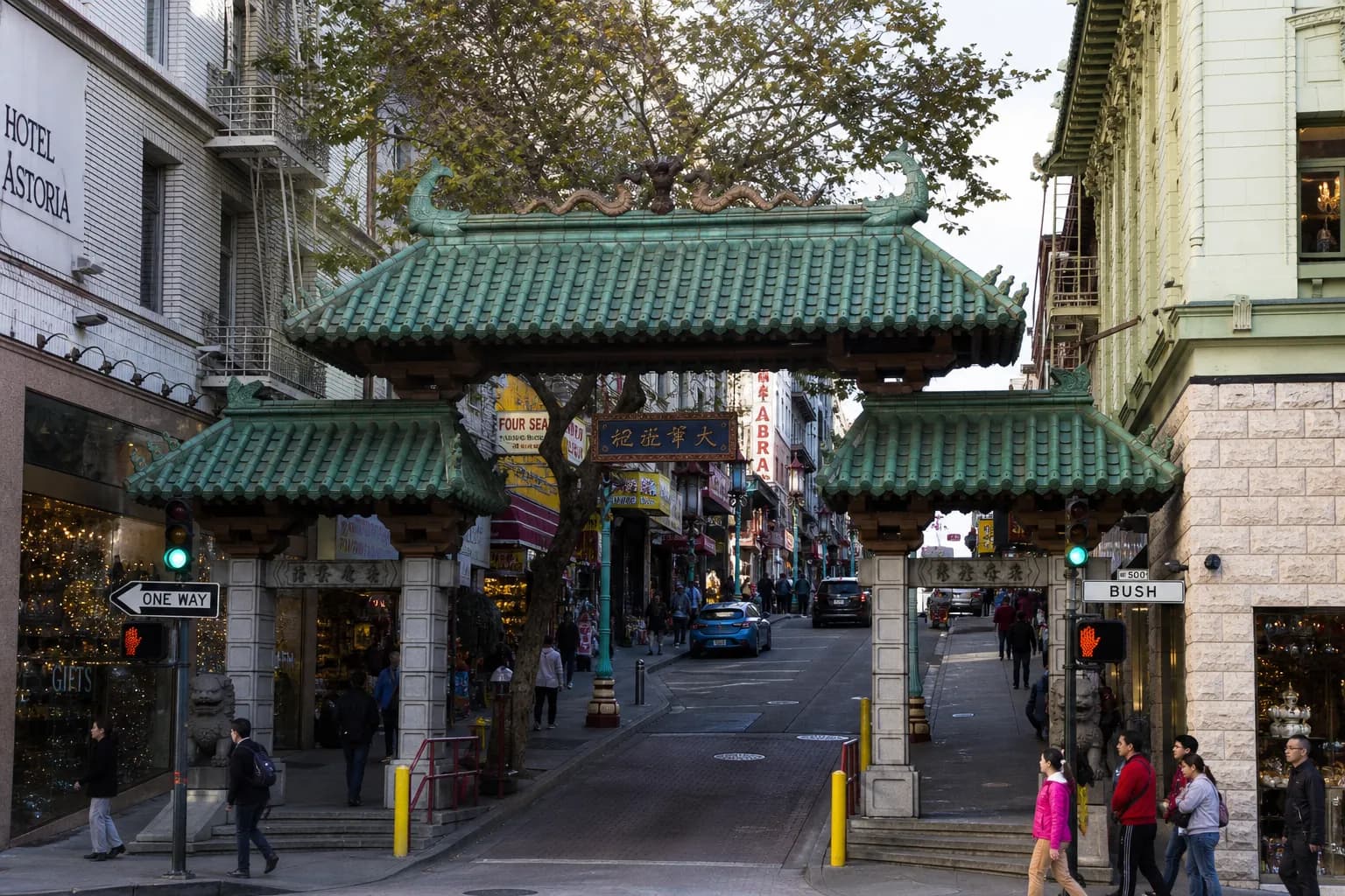 San Francisco Chinatown street with classic storefronts and hanging lanterns before lunch rush