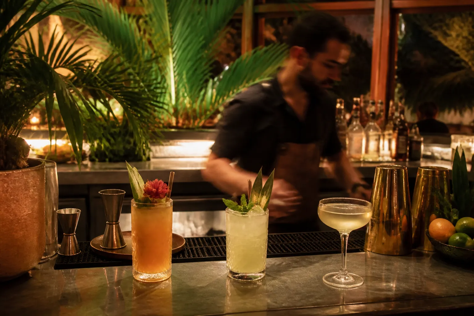 Miami cocktail bar counter with tropical drinks and low warm lighting