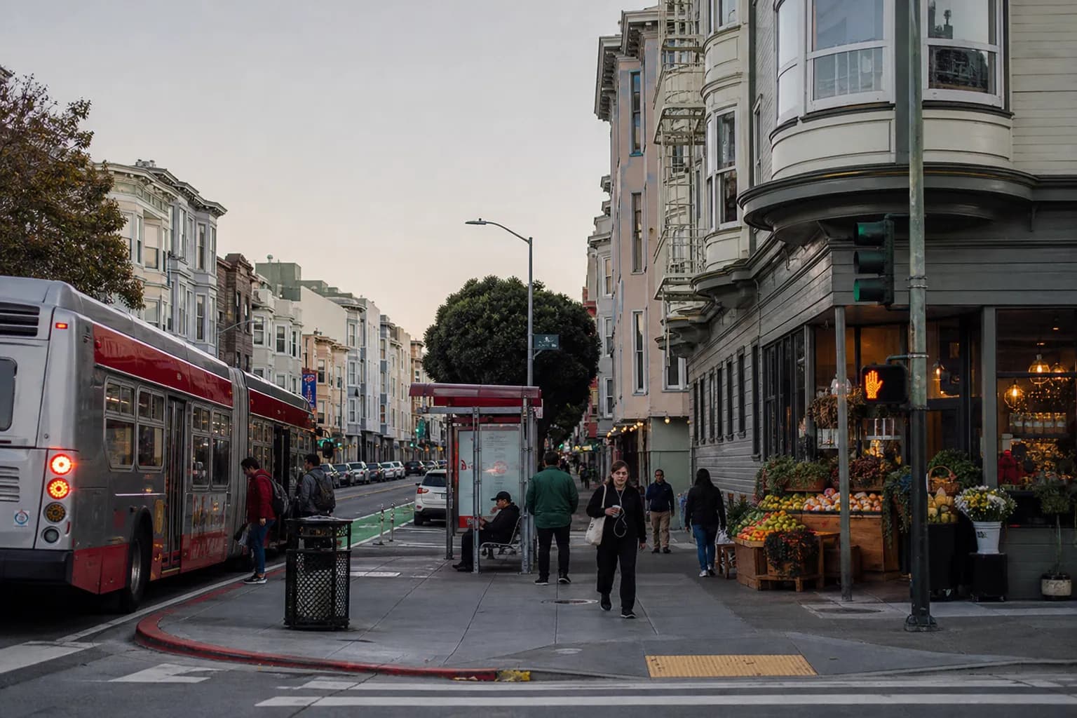 Muni bus moving through a calm neighborhood street in San Francisco