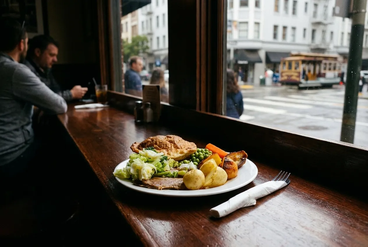 A single plated course under a spotlight on a dark polished counter