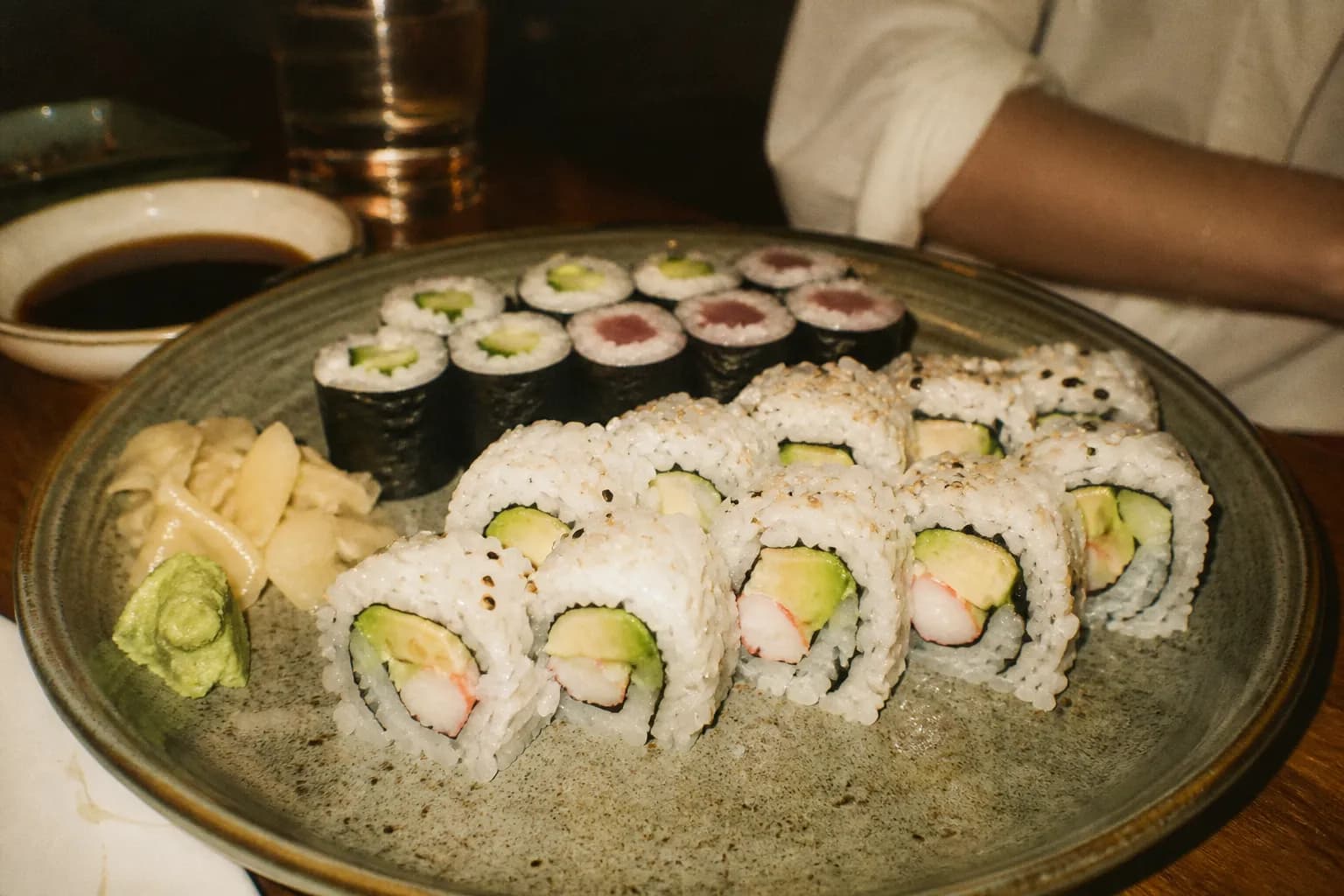 A plate of California rolls and simple beginner-friendly sushi rolls