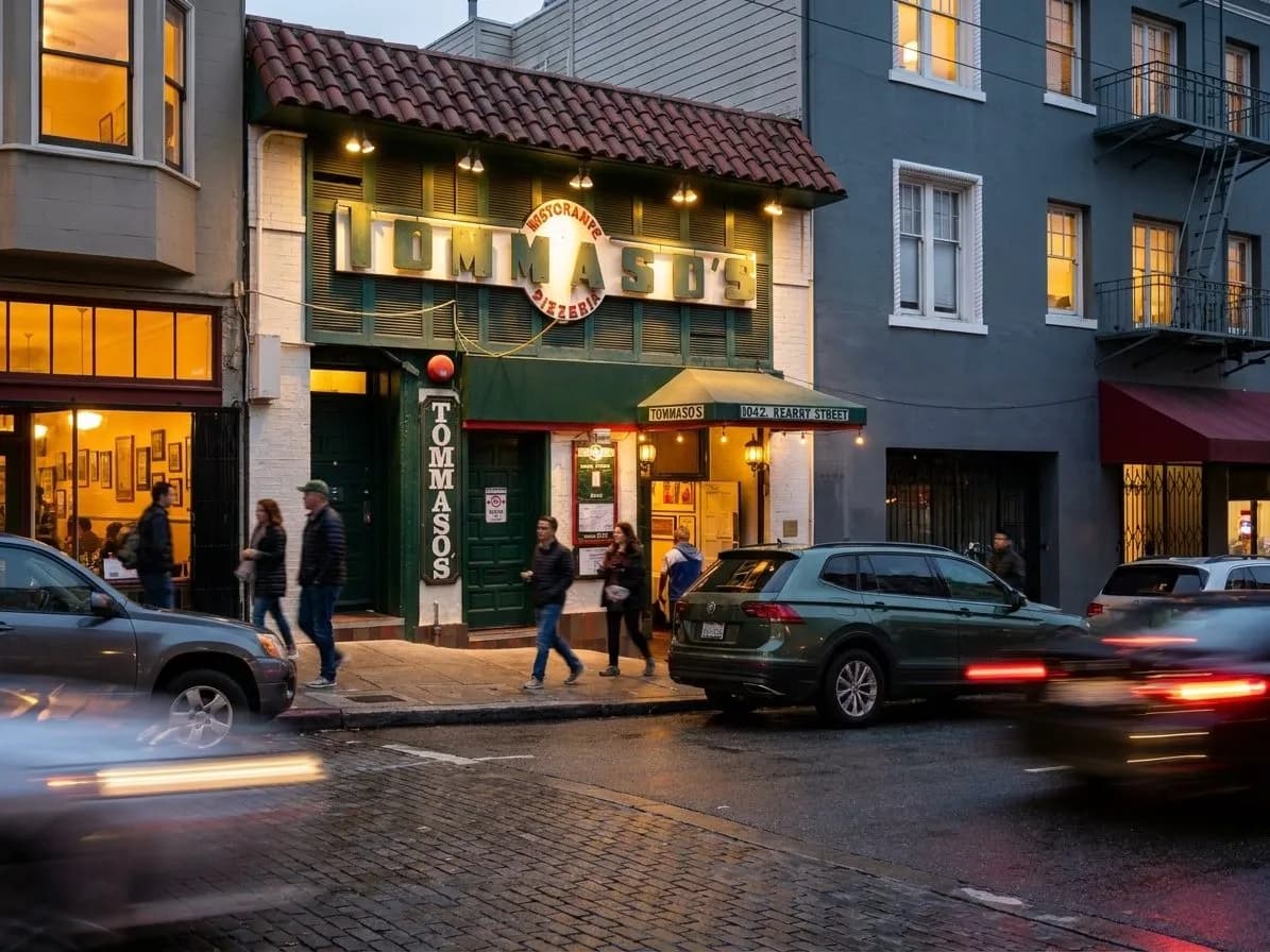 North Beach restaurant block with warm evening light and sidewalk traffic