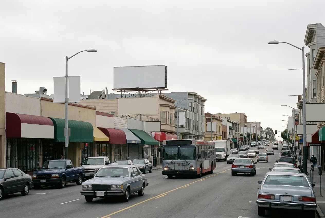 A long commercial street in outer San Francisco with awnings and morning traffic