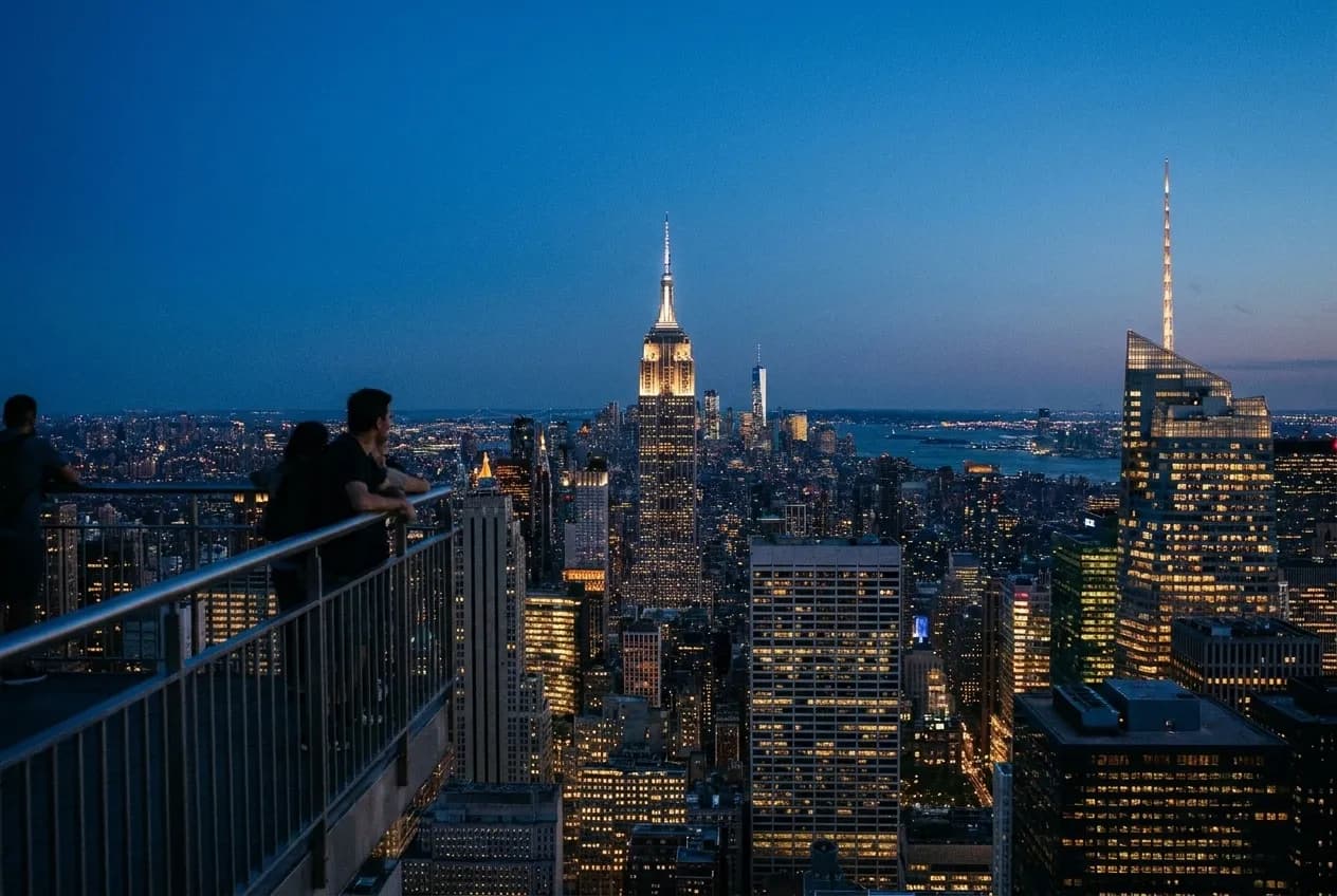 Manhattan skyline view from observation deck during blue hour with Empire State Building and city lights
