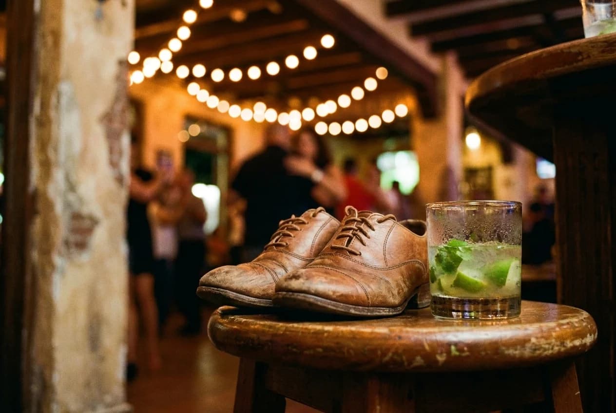 Leather dance shoes and mojito on wooden table in Little Havana salsa club