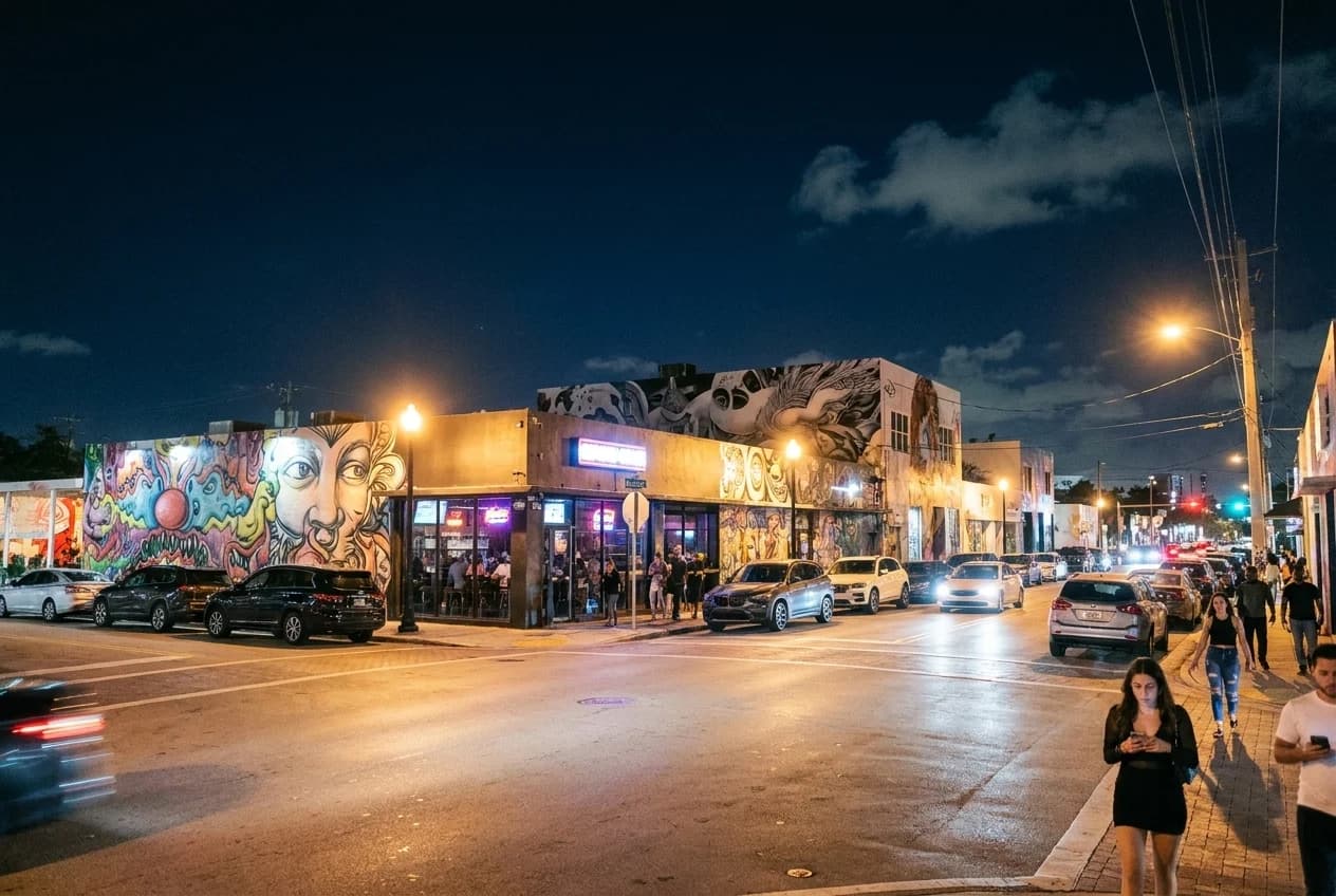North Miami Avenue in Wynwood at night with bar and restaurant signs illuminated