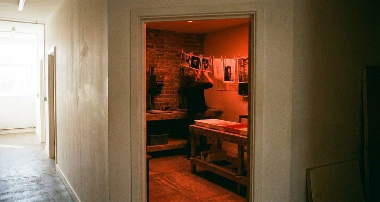 A Community Darkroom Where Prints Dry on the Line and Fixer Smell Fills the Air - scene