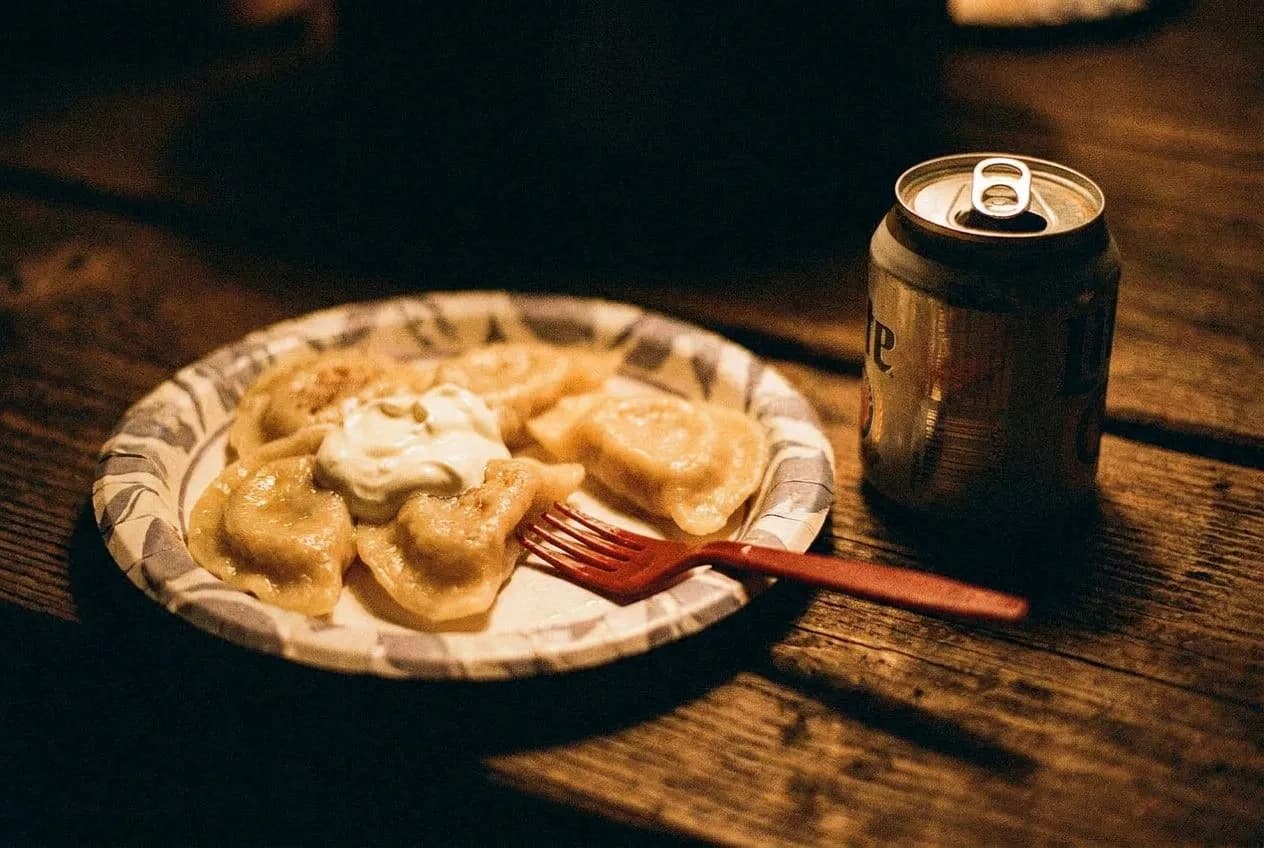 Corner table at Sophie's Bar where the pierogi are served on paper plates and the back room stays empty until midnight