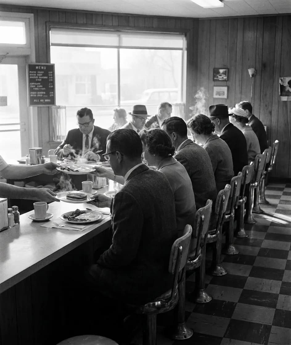 Counter at Tom's Restaurant where the griddle faces the stools and eggs cook to order in Prospect Heights