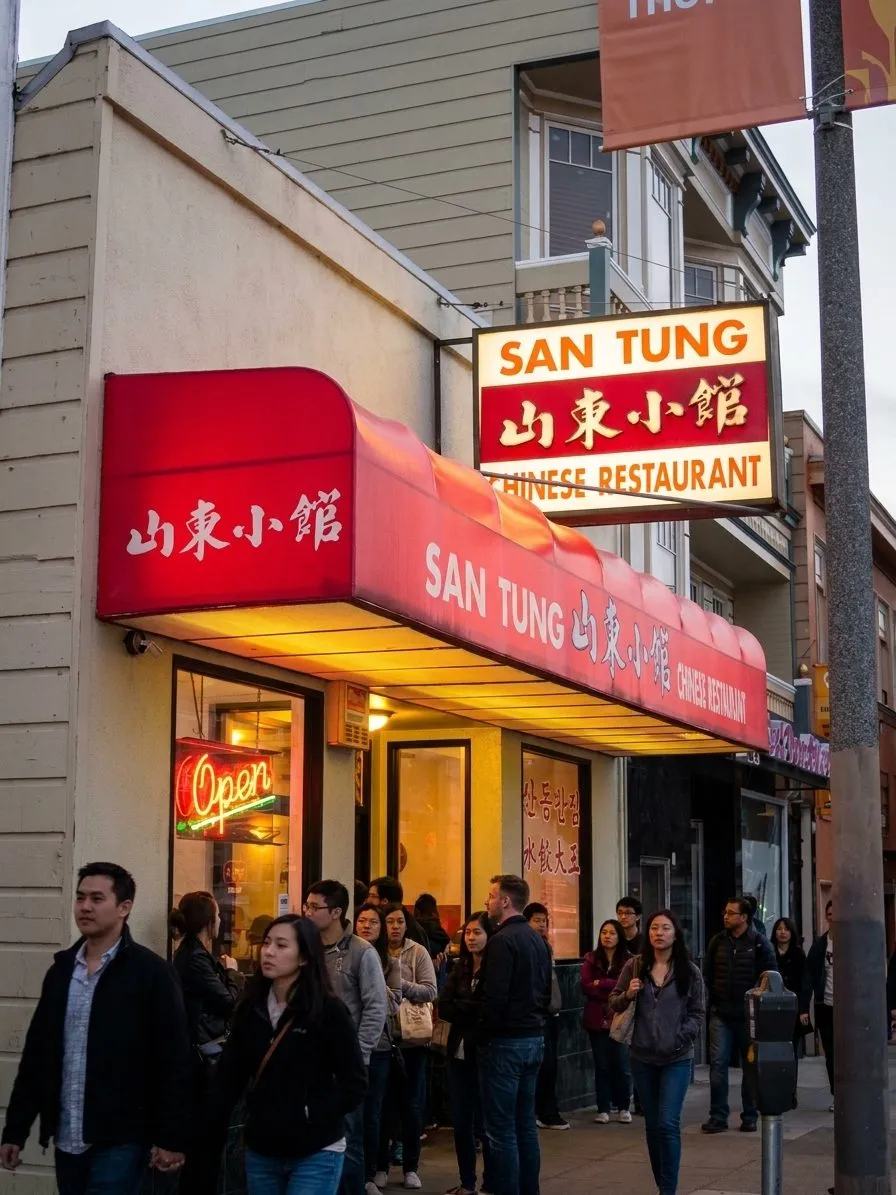 San Tung storefront on a San Francisco neighborhood street at dusk