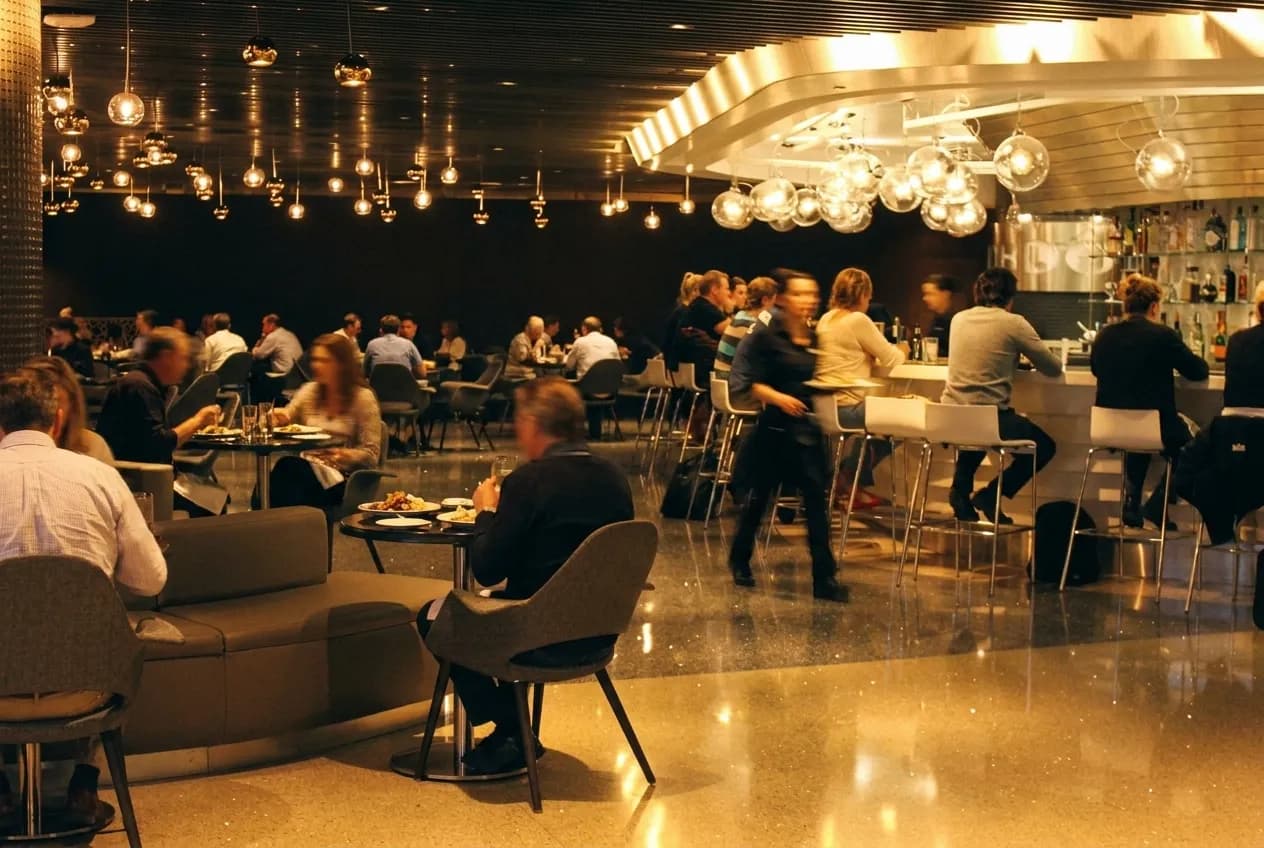Interior of a Los Angeles restaurant during early evening service with diners at tables