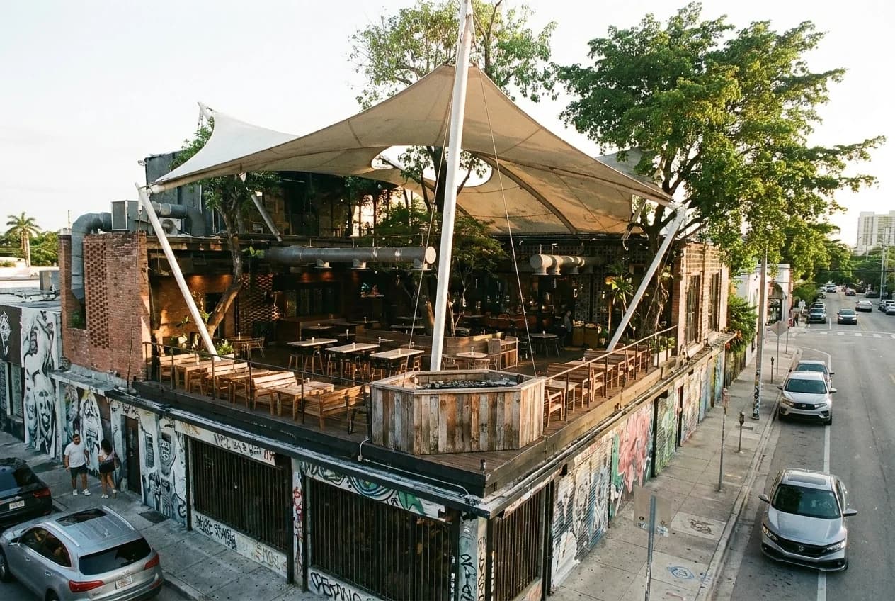 Fabel Wynwood rooftop dining room with tent ceiling and central DJ booth before evening service