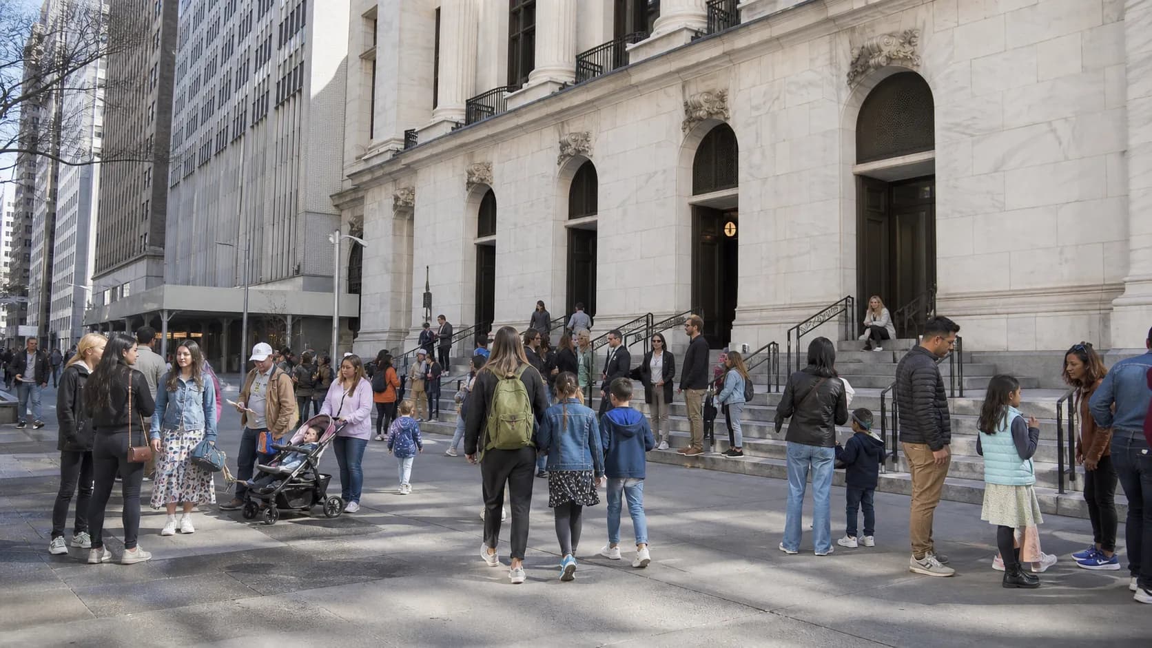 Visitors gather outside a Queens museum for a family-friendly film exhibition visit.