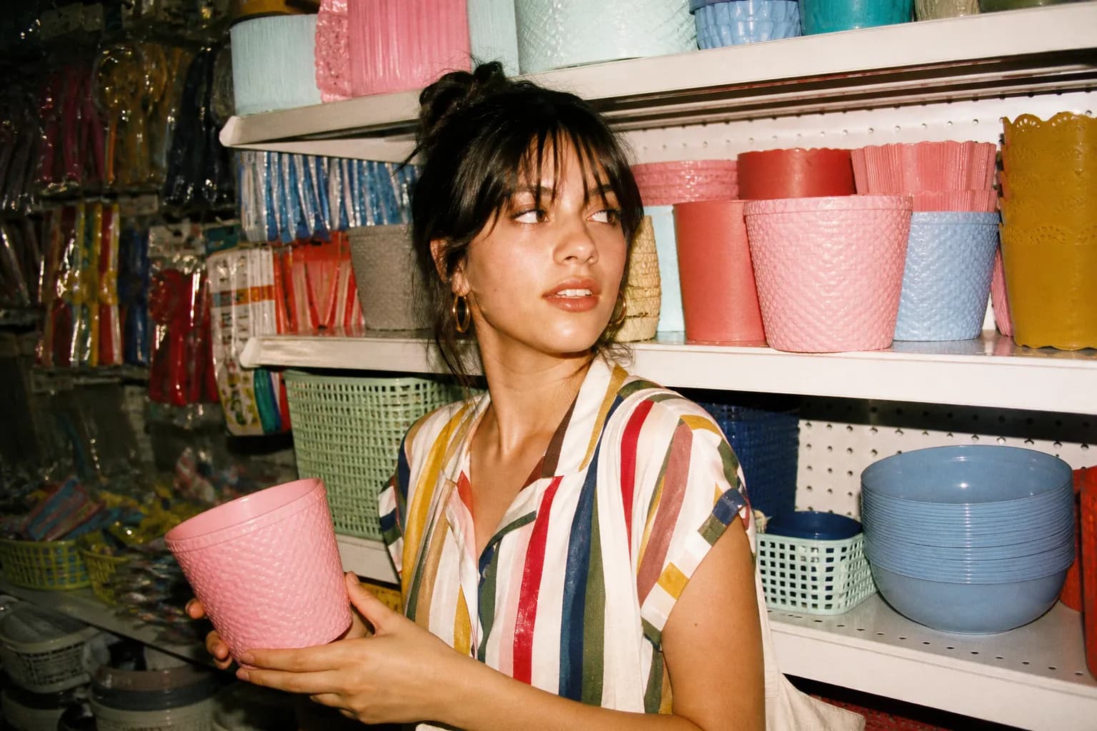 Colorful budget goods arranged on bright discount store shelves in a well-lit aisle