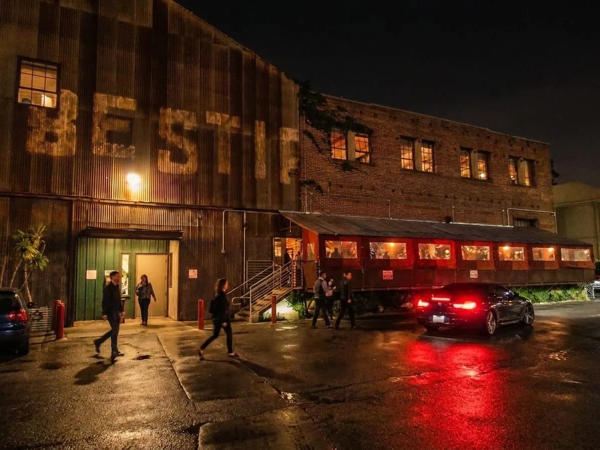 The exterior glow of Bestia in the Arts District after dark