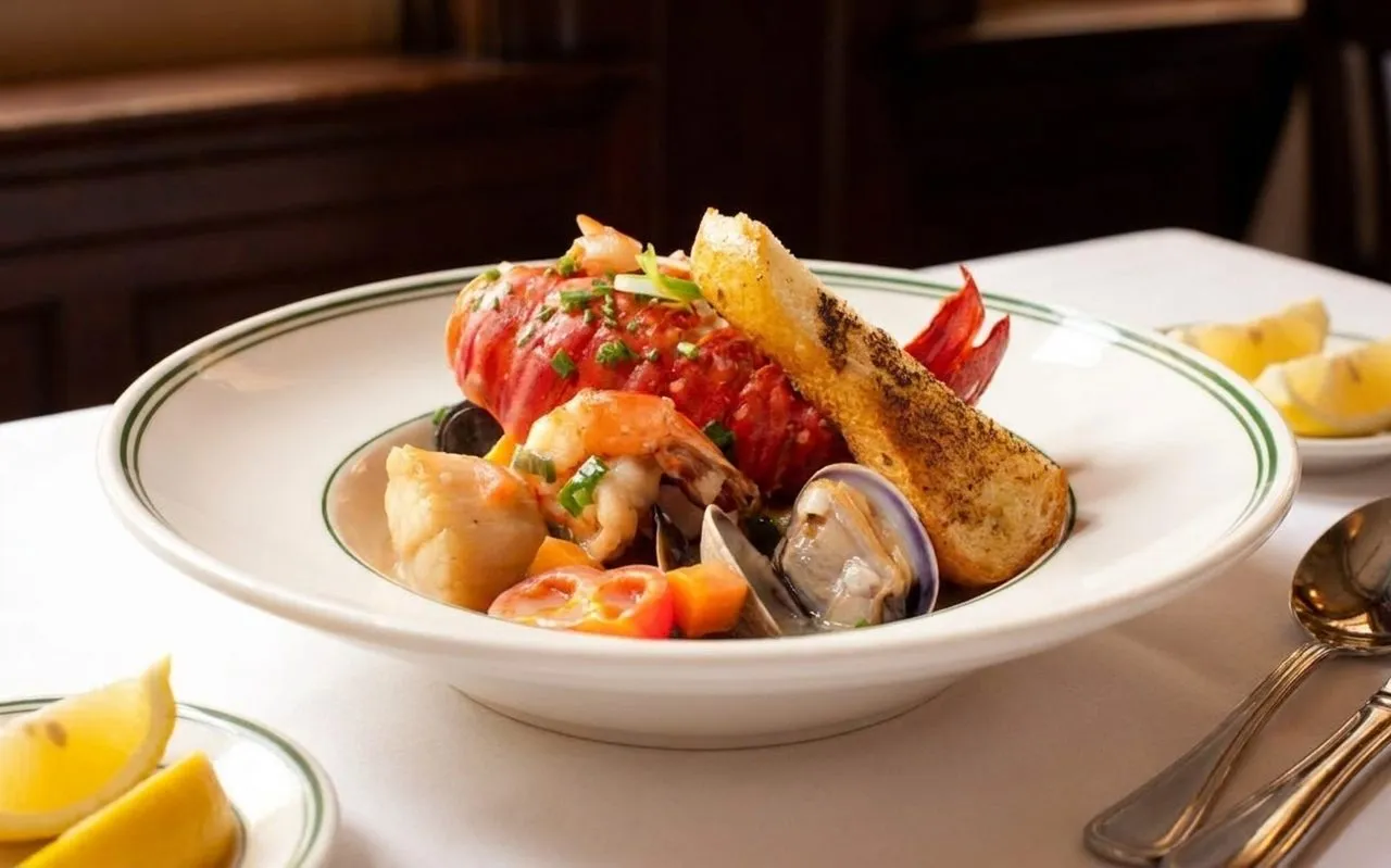 Classic San Francisco seafood dinner spread on a white tablecloth