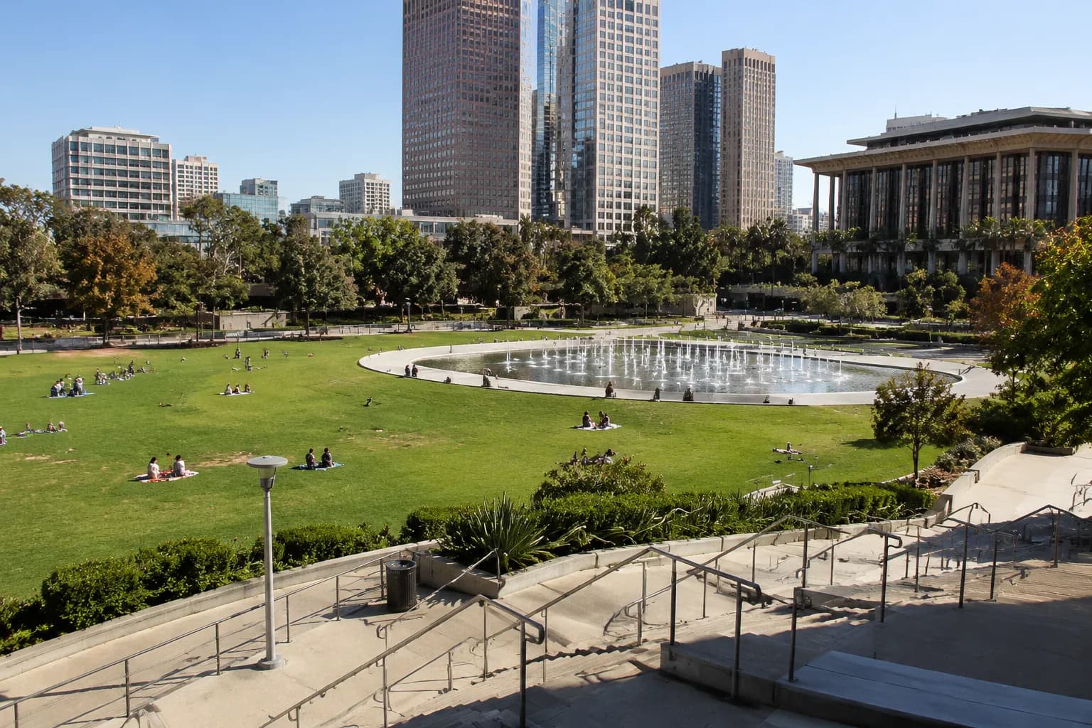 Grand Park downtown Los Angeles with lawn, fountain, and city towers in the background on a sunny afternoon