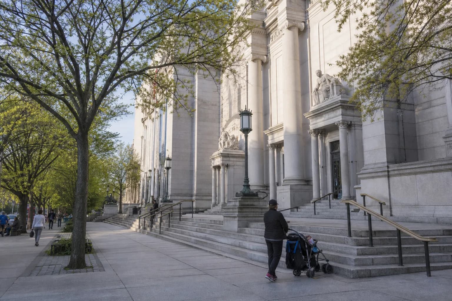 Upper West Side museum exterior with strollers and trees