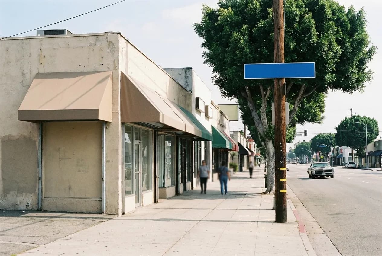 A low-rise commercial street with wide pavements and street trees in a quiet Los Angeles neighbourhood