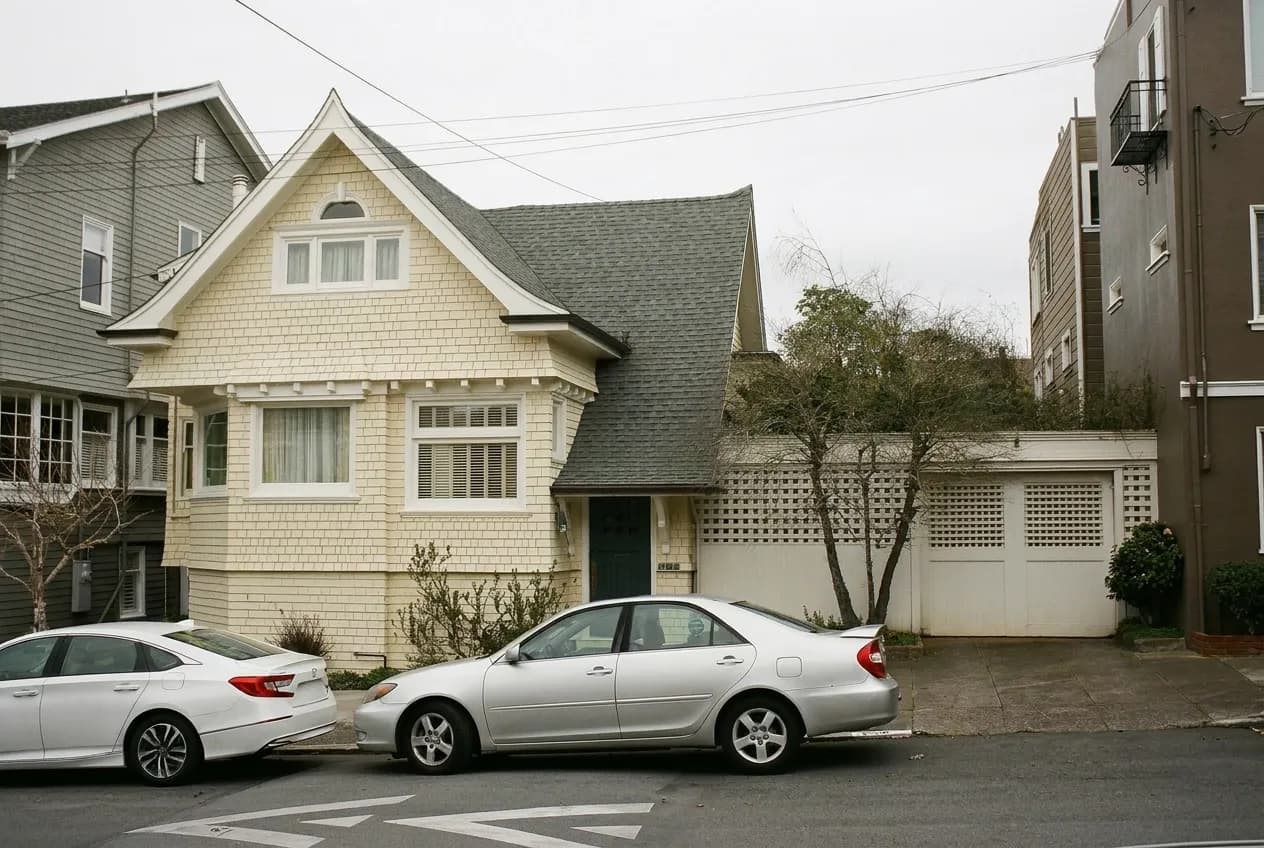 A San Francisco landmark viewed down a residential street between buildings