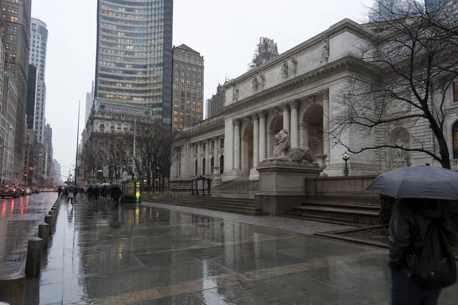 Rainy Midtown street view with a grand public library facade and wet pavement