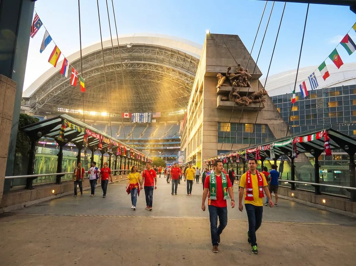 Retractable stadium roof partially open allowing bright Texas sunlight to illuminate the pitch below