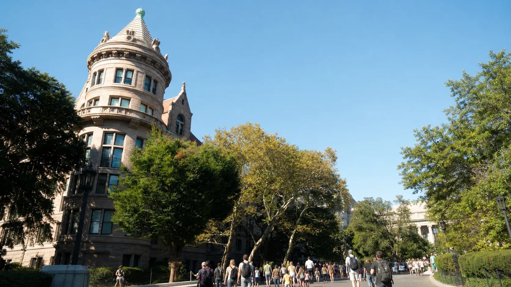 Visitors approach the American Museum of Natural History on Central Park West in daylight.