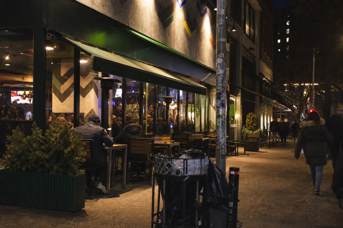 Cover scene for Gotham FC Away Match at Football Cafe: A LES Screen Plan for Solo Fans