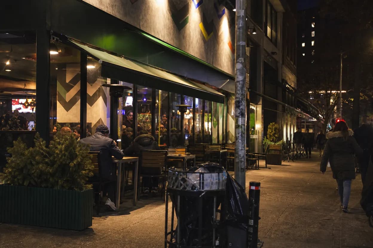 Cover scene for Gotham FC Away Match at Football Cafe: A LES Screen Plan for Solo Fans