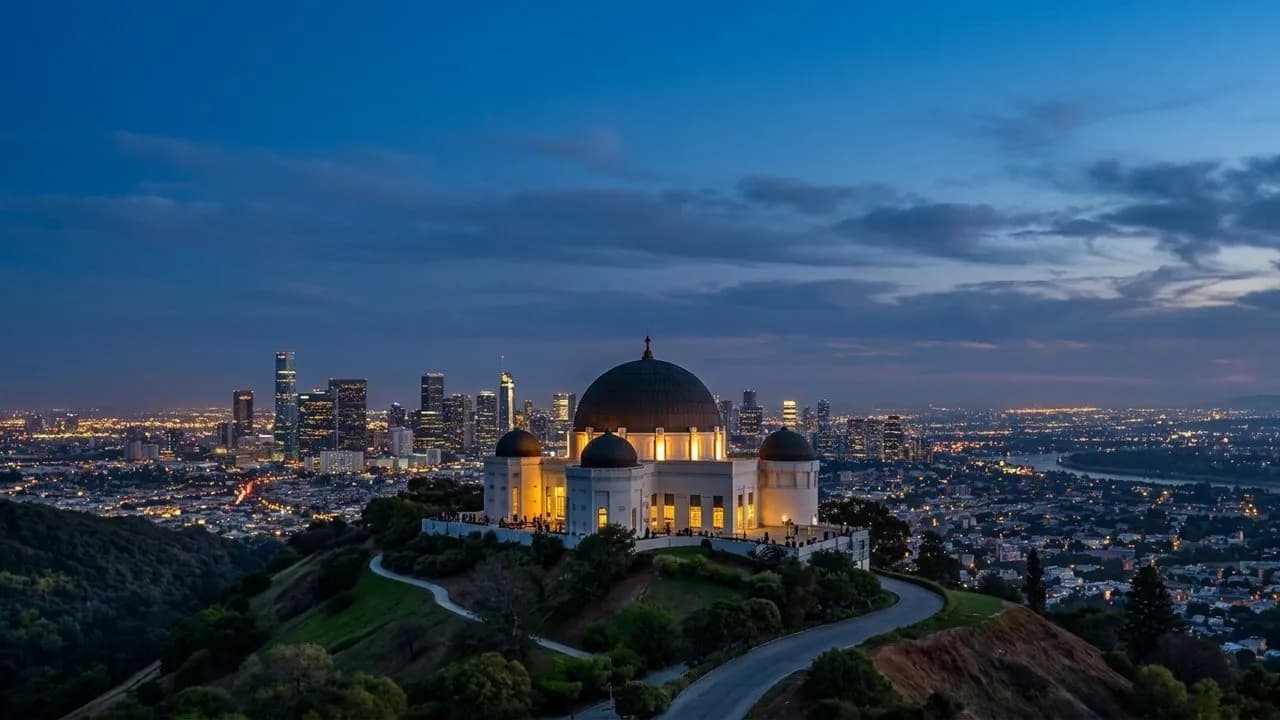 Griffith Observatory glowing above the city at dusk