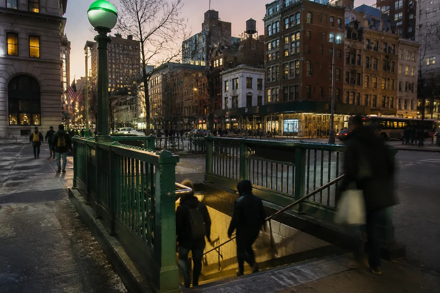 Union Square subway station entrance on 14th Street with morning commuters