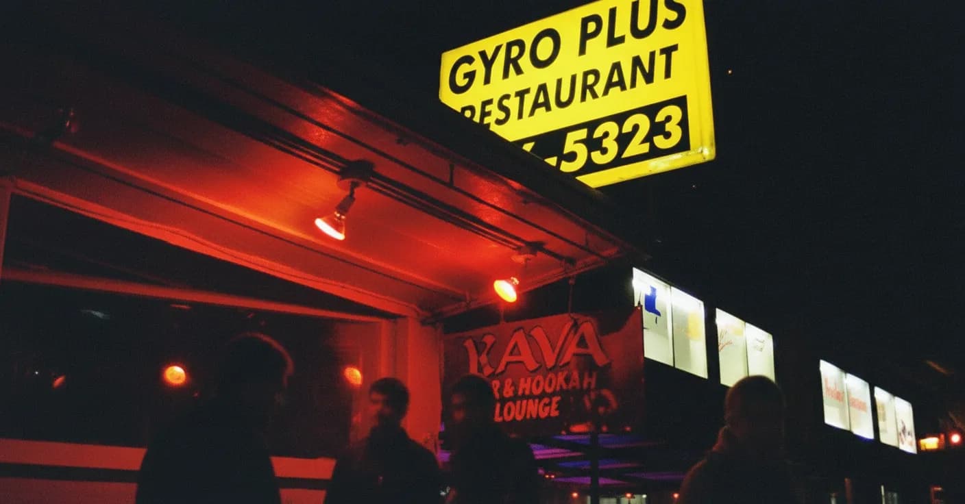An offbeat little neighborhood spot glowing at night