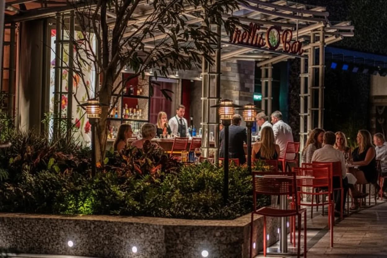 A buzzy, glamorous restaurant dining room at night