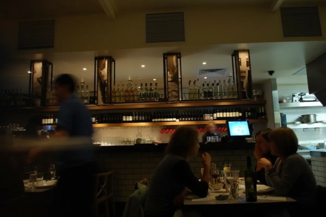 A quiet, characterful neighborhood spot glowing at night