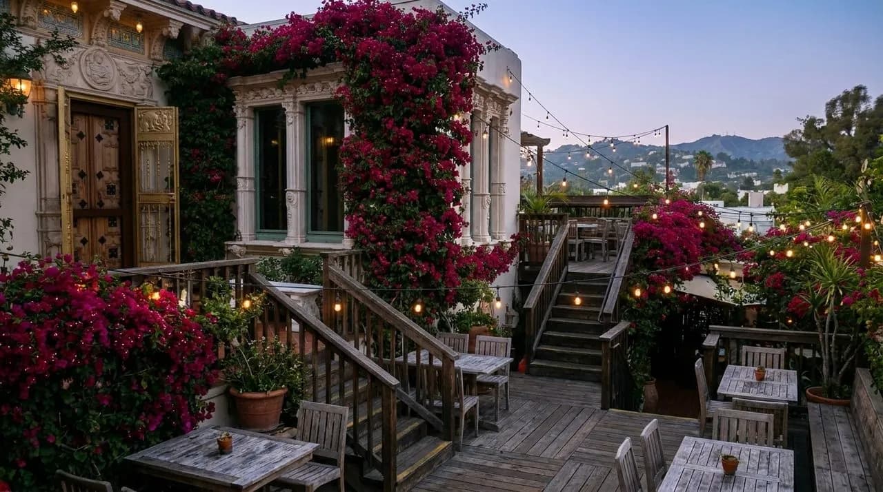 Multi-level outdoor patio surrounded by blooming bougainvillea at Bar Flores on Sunset Boulevard