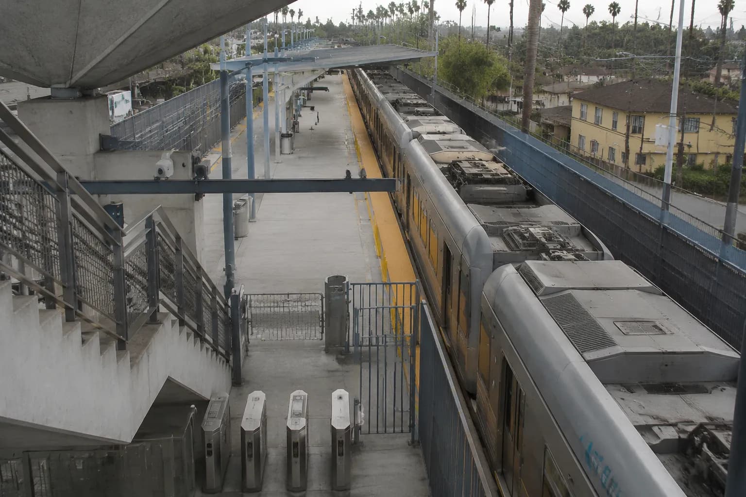 Expo Line Metro station platform with train and safety markings