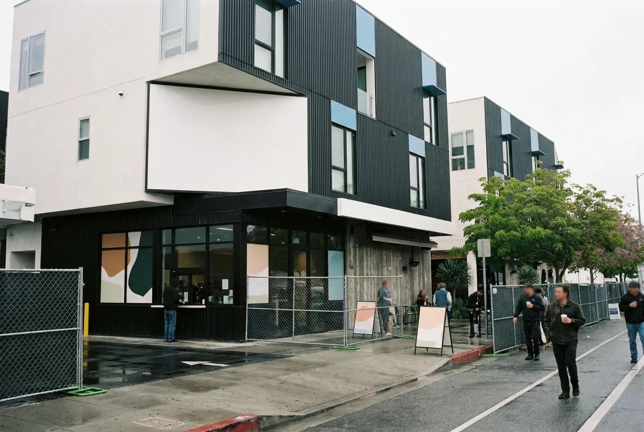 A low-slung eastside coffee bar seen from the pavement in flat morning light