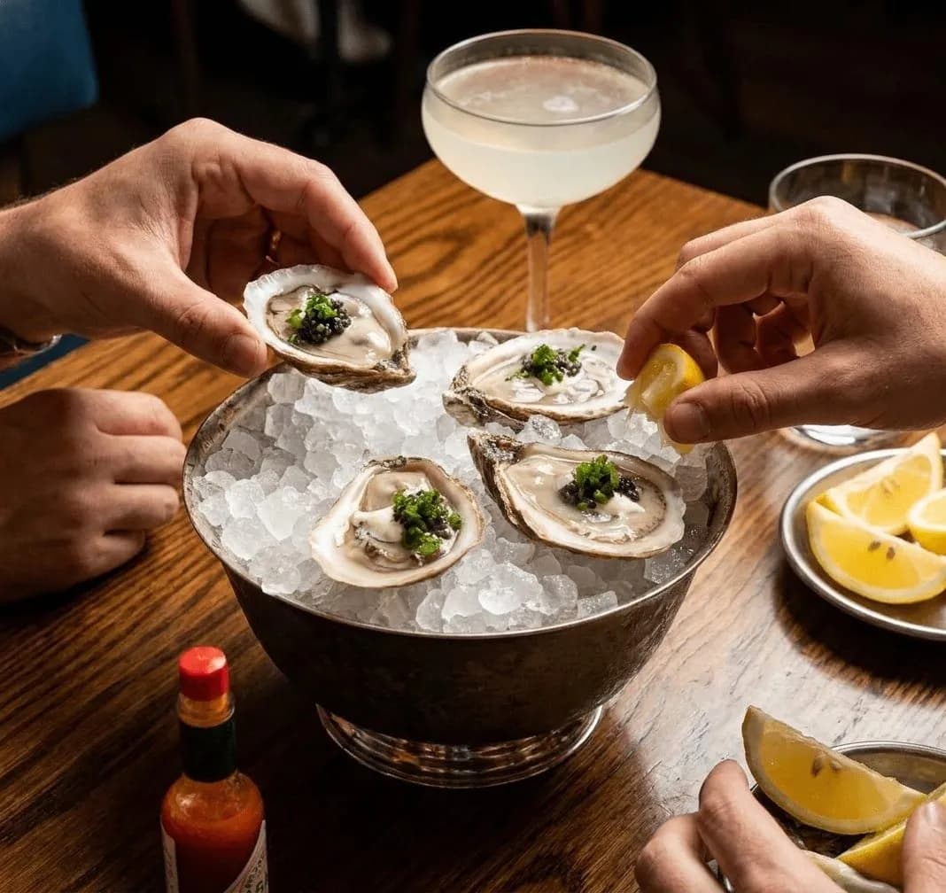 Oysters and a chilled drink on a seafood counter in Los Angeles