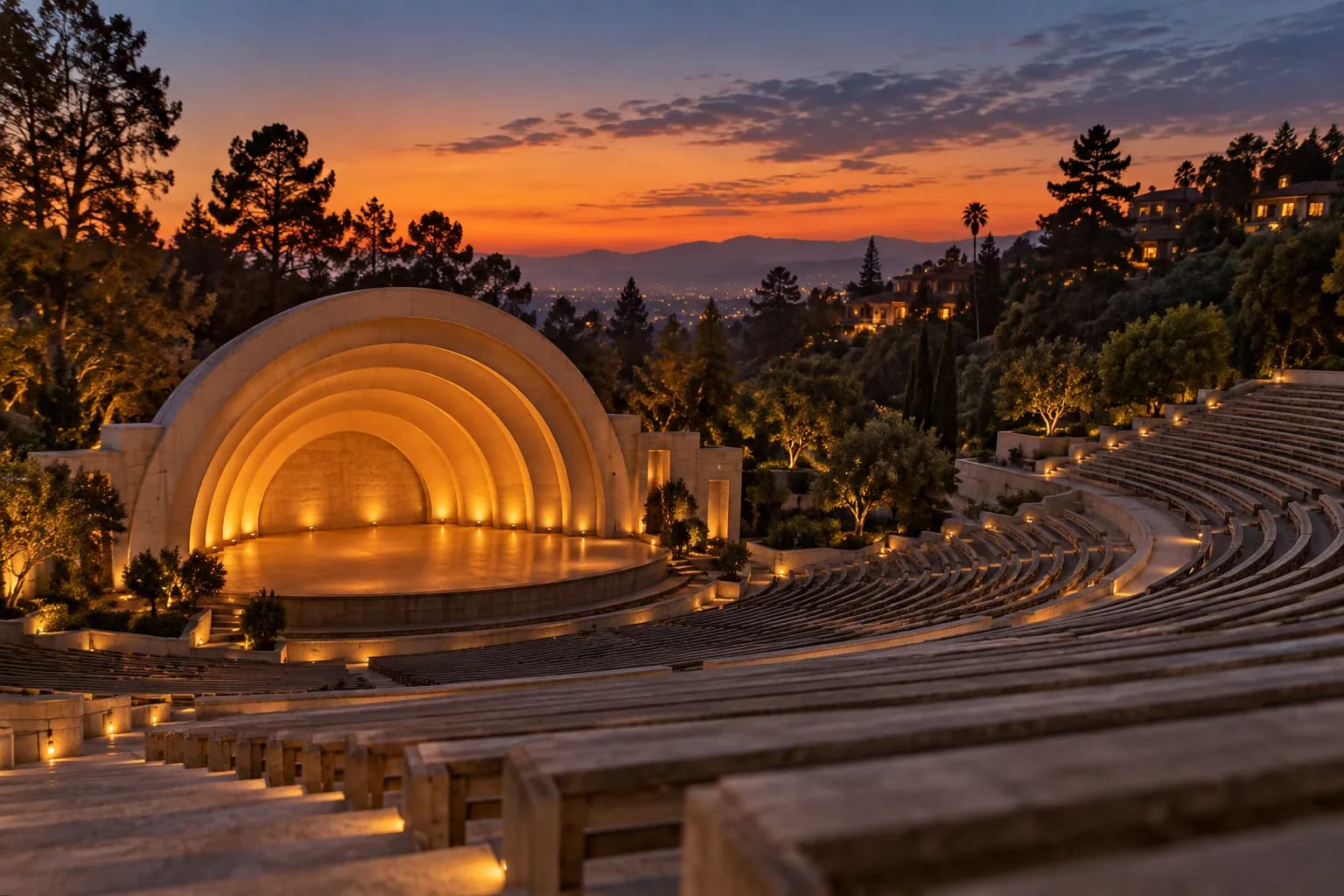 A large outdoor amphitheatre in the hills at dusk