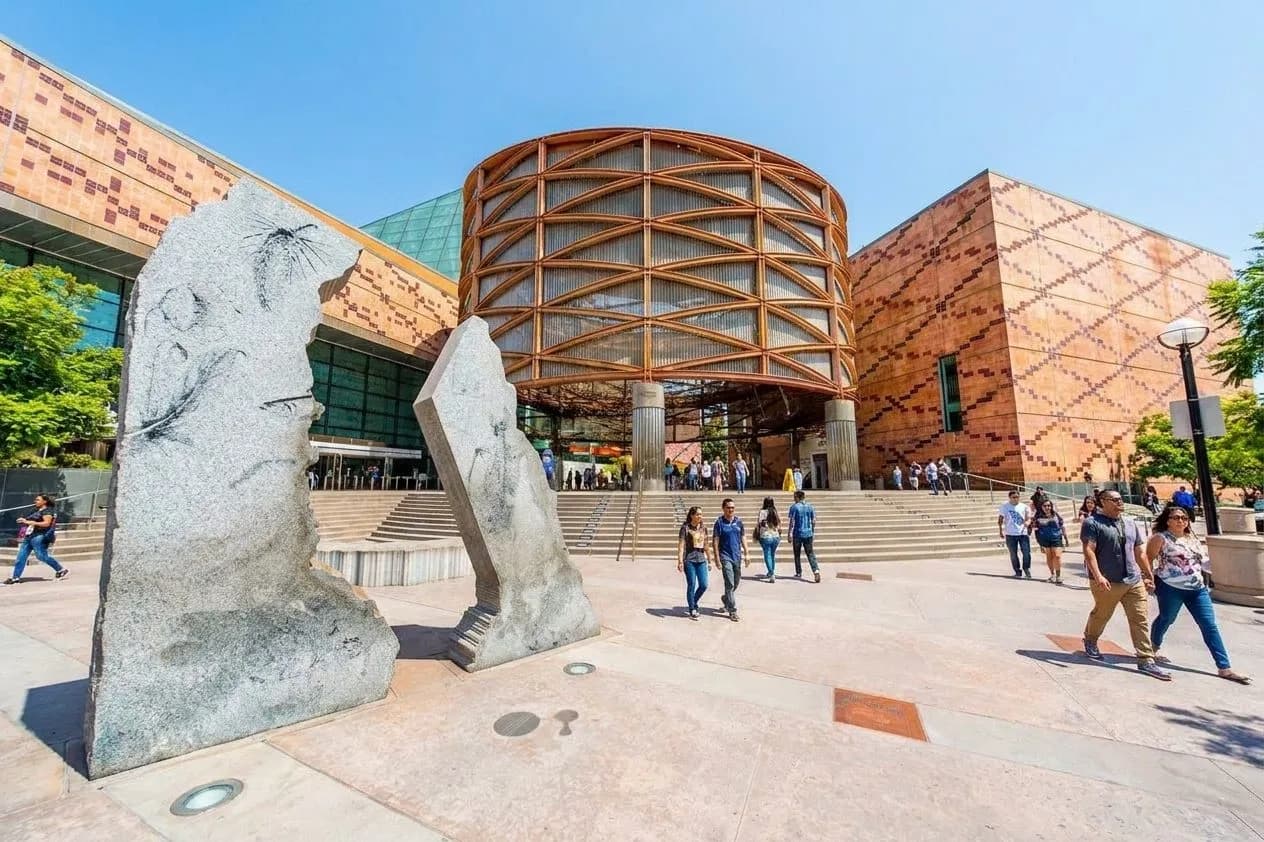 California Science Center plaza with visitors in Exposition Park
