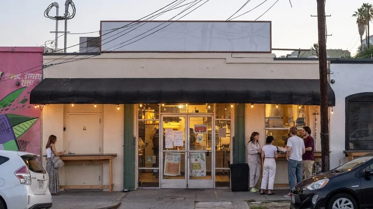 Quarter Sheets exterior glowing at dusk in Echo Park