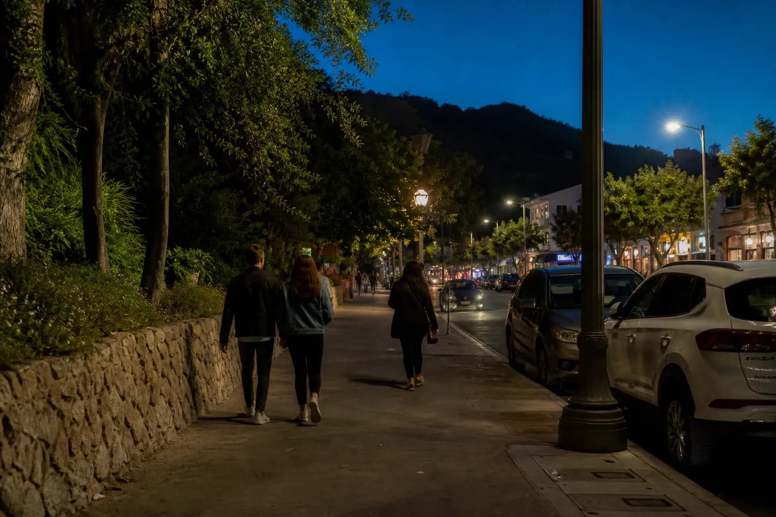 Evening sidewalk near Griffith Park with people walking toward dessert after dinner
