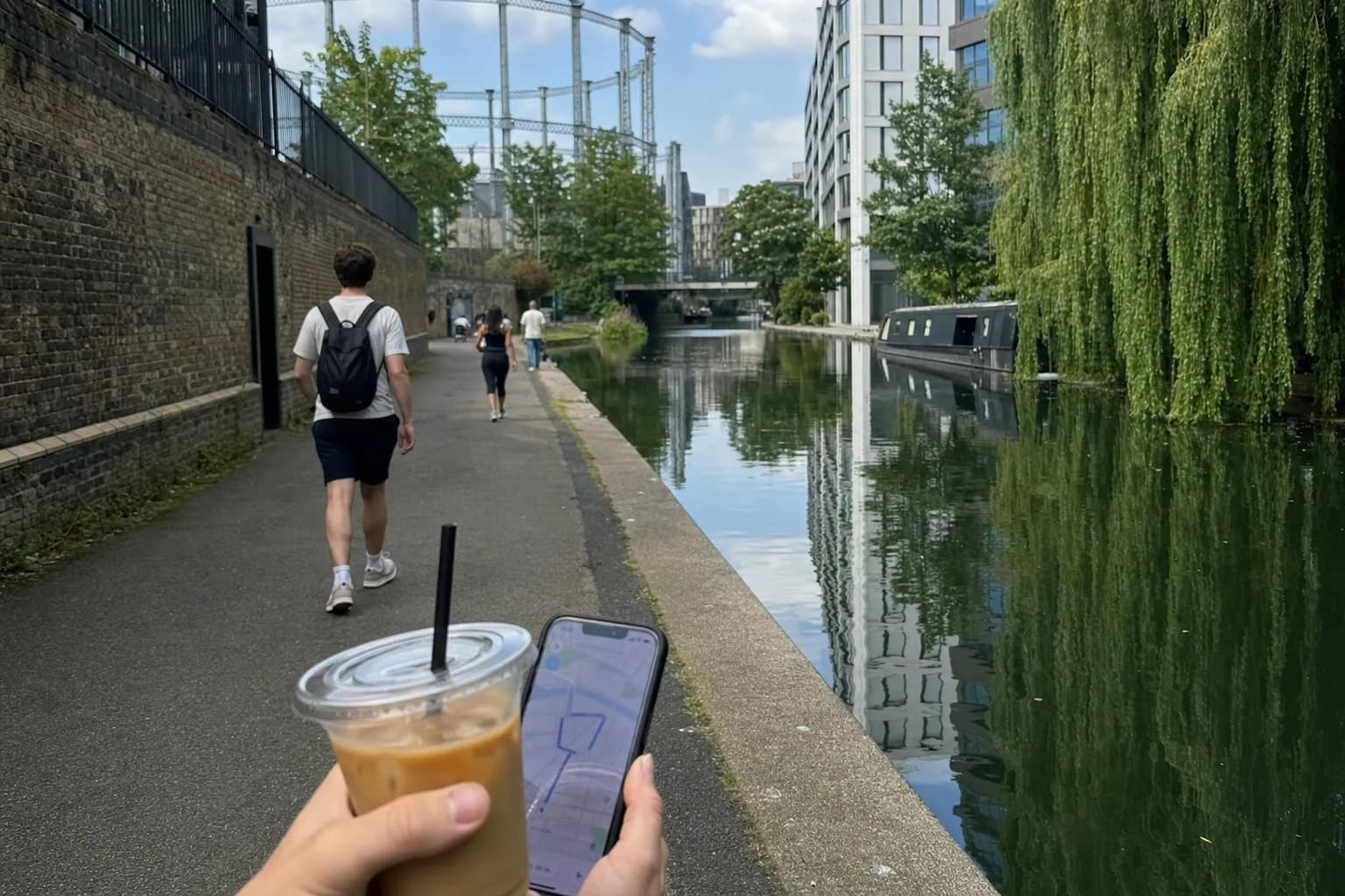 King's Cross canal path with iced coffee and route phone