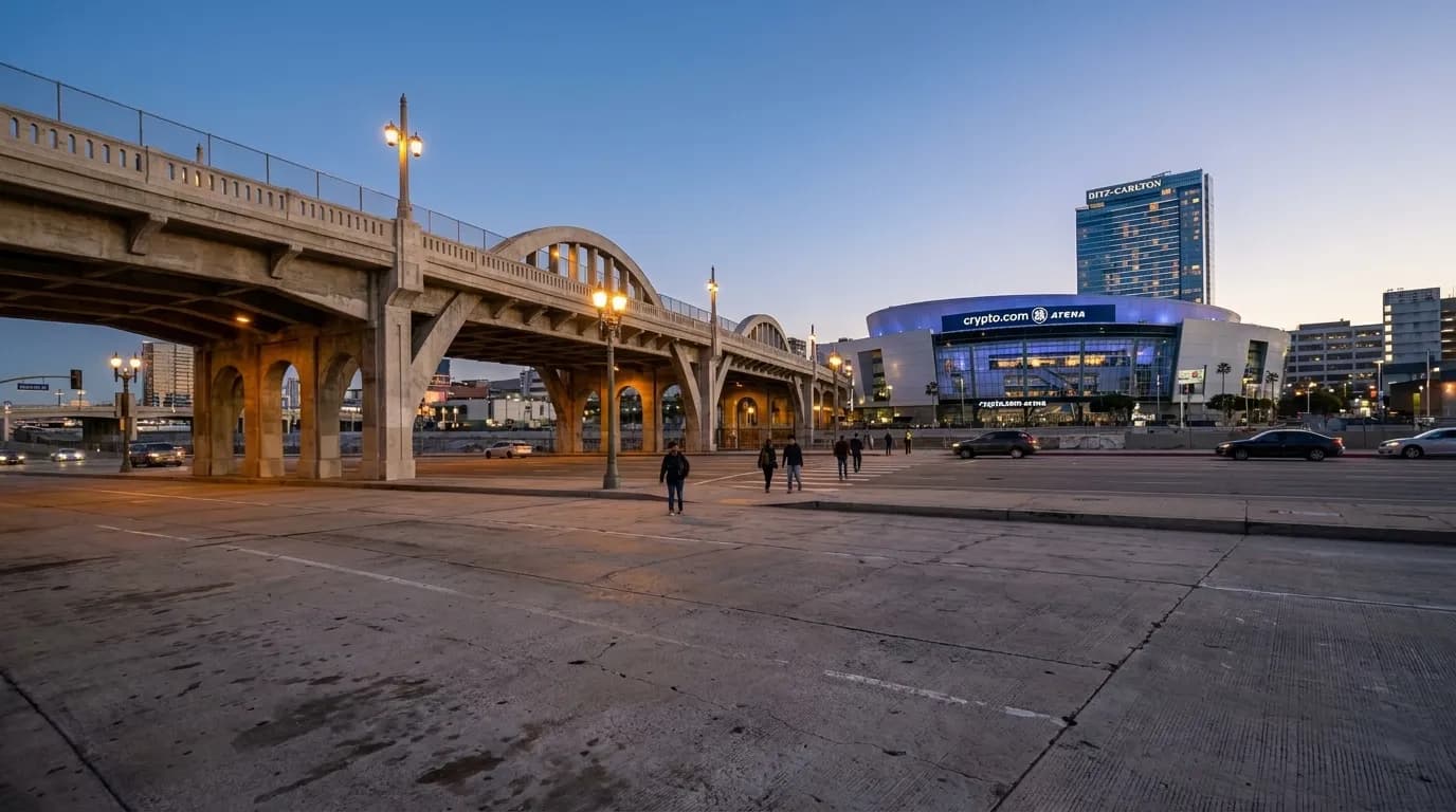 LA Live plaza at dusk with Crypto.com Arena and downtown towers in the background