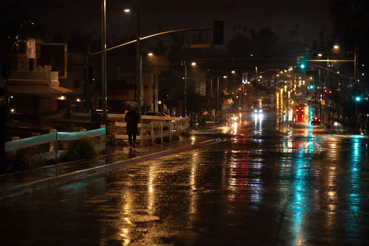 Sunset Boulevard intersection in Los Angeles at night in the rain