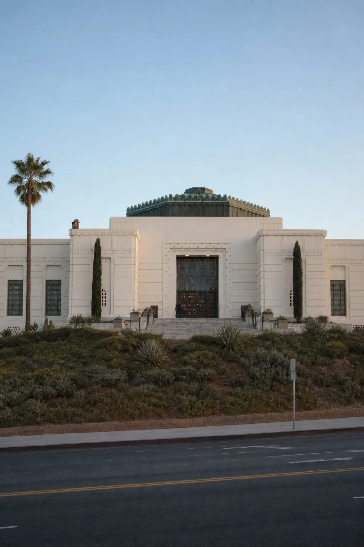 Domed observatory building on a Los Angeles hillside at dusk