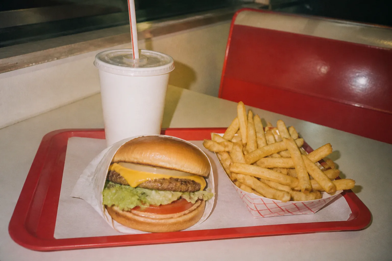 A value meal with fries and a drink arranged on a tray